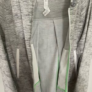 Lululemon size 6 swing jacket. Only worn once.  White, grey and neon green trim